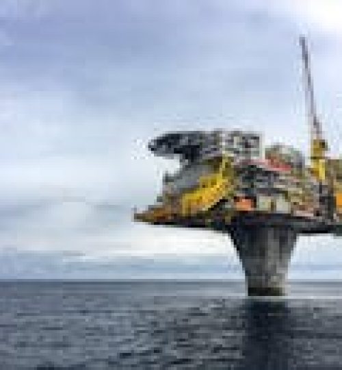Dramatic view of a large oil platform in Norway's North Sea, symbolizing offshore industry.